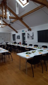 Long tables set out for a village supper