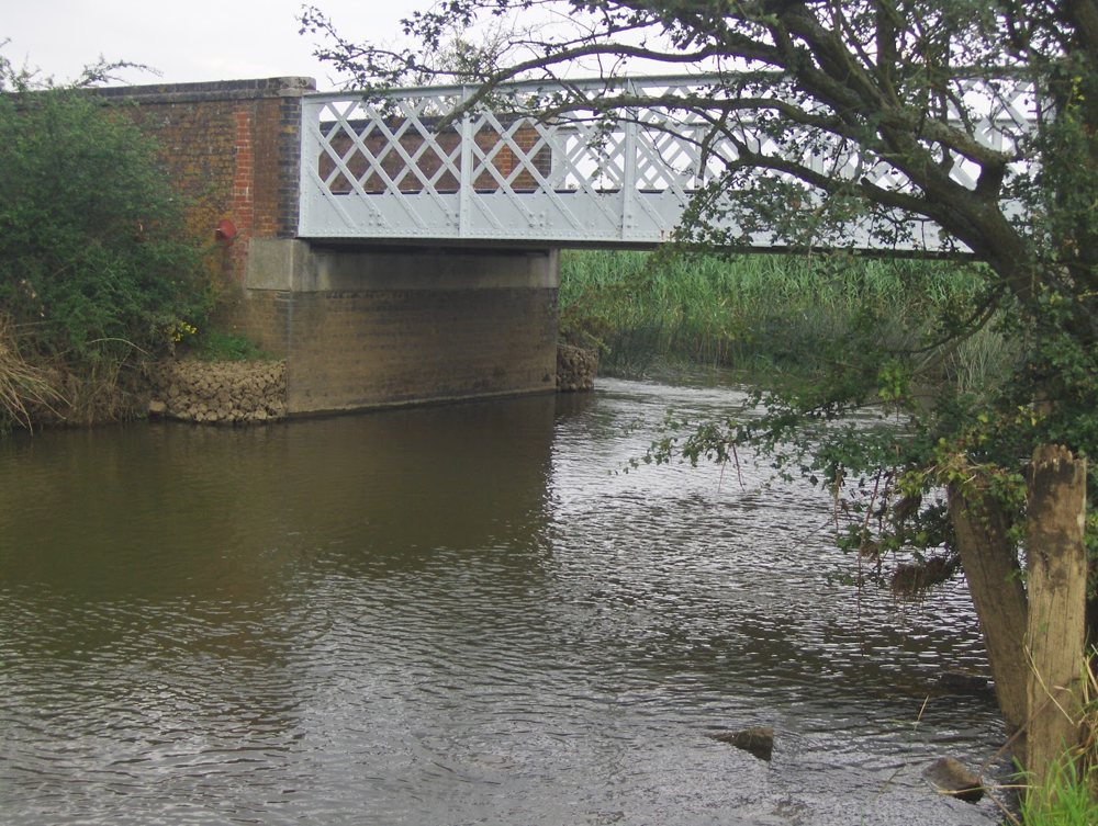 The iron lattice road bridge over the River Cherwell, on brick abutments
