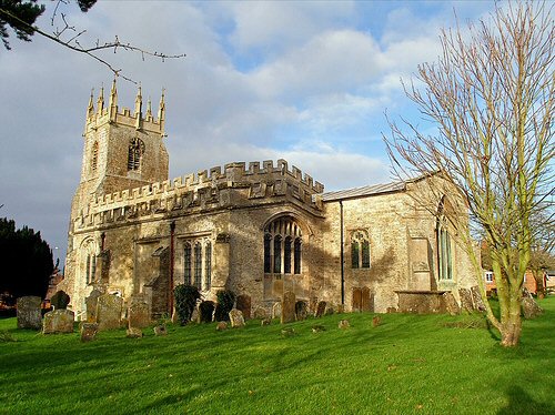 St James's church today from the south, with its pinnacled tower and battlemented roofline